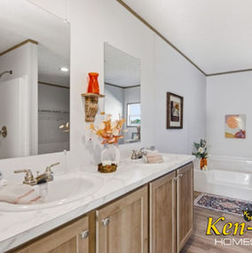 Bathroom with double sinks and mirror, Ken-Co Homes Inc. white walls and bath.