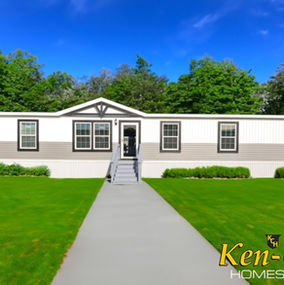 Exterior view of Ken-Co Homes Inc. mobile home with a pathway leading up