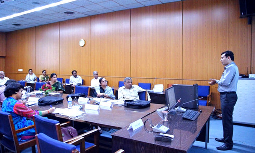 Lecturer addresses attentive audience of senior leaders in a training session
