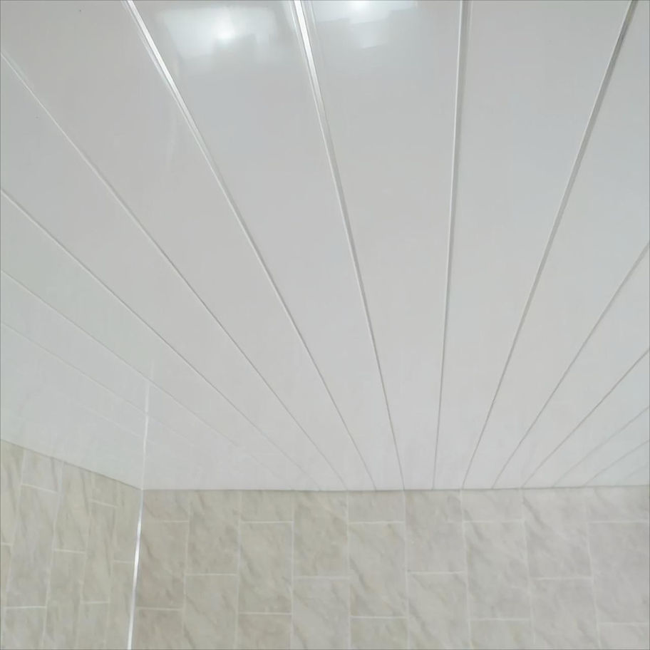 White chrome gloss ceiling panel in modern bathroom
