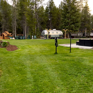 The lawn area w/airstream bar at West Glacier KOA