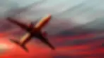 4k-plane-flying-in-red-sky-elfd75phgei6c607.webp