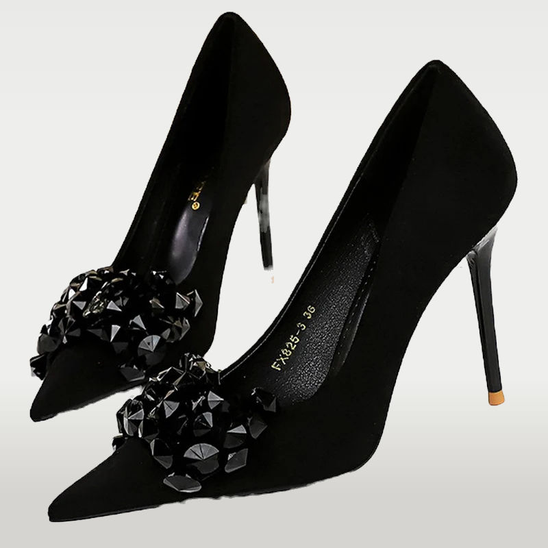 Flock pumps with a pointed toe, super high heel, and slip-on design. Soft flock upper for a textured look. Perfect for summer