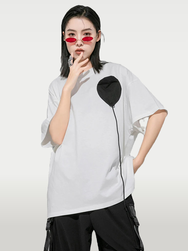 Women's Patchwork Tee in black and white. Soft jersey fabric with crewneck, short sleeves, and black and white patchwork desi