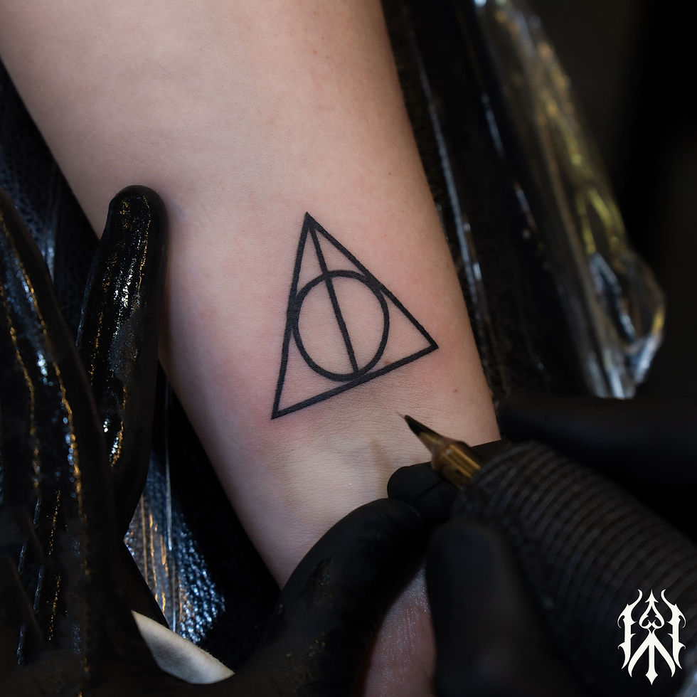 circle in triangle tattoo.jpg