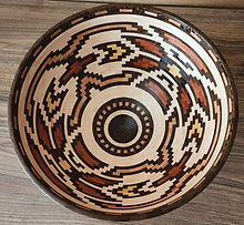 Handcrafted segmented wood bowl with geometric patterns