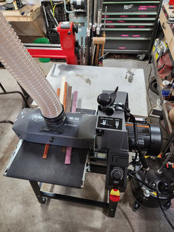 Commercial drum sander with dust collection hose
