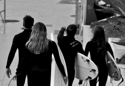 Swimmers wearing SEAR in Portugal - Best Waterproof Earplugs for Surfing