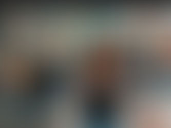 Person filming TikTok on a busy street, colorful mural in background. Text on image: How to Find TikTok Influencers for Effective Influencer Marketing