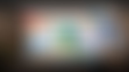 Robot hands interact with a computer screen displaying colorful app icons and a ChatGPT logo. Text above reads "ChatGPT Prompts for Content Marketing."