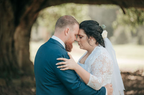 bride and groom touching foreheads