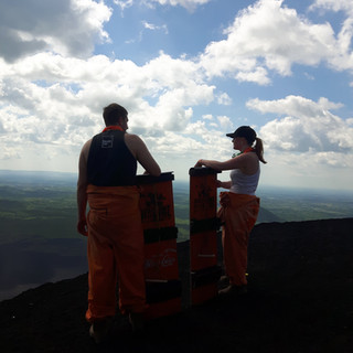Missy and Lucas on top of Cerro Negro volcano boarding