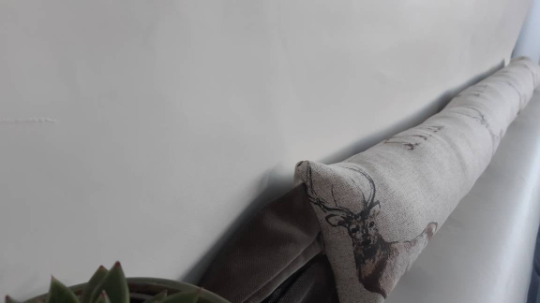 Thumbnail: Red Deer Stag animal print draught excluder on a beige background.