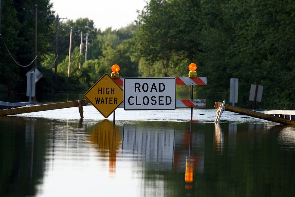 flooded road with closure sign