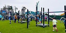 Children playing on a large playstructure at El Granada Elementary