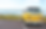 Yellow vintage van parked by the ocean symbolising how the brain notices what it believes is important, an example of changing limiting beliefs.