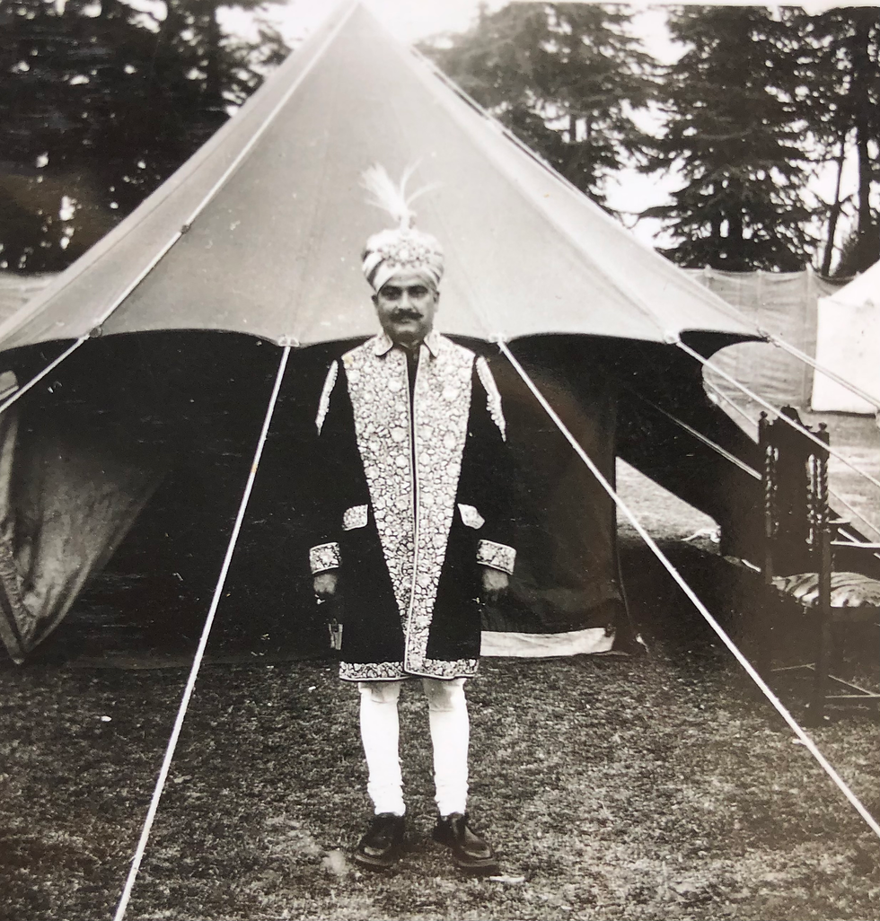 Raja Mohinder Singhji standing in front of his Dussehra camp