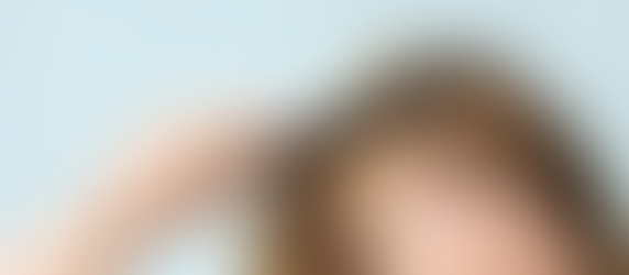 Woman with hair loss combing hair