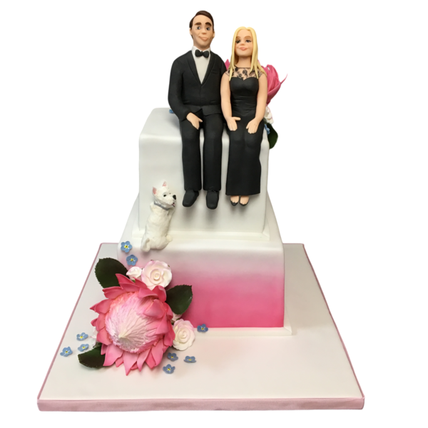 Two-tier wedding cake with sugar figurines, pink flowers, and a sugar-crafted dog.