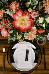 big peonies the star of this flower arrangement on table with stationery and table settings