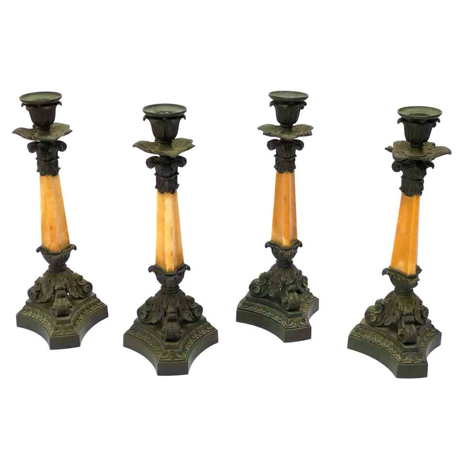 Four French mid-19th c. bronze and Yellow Sienna marble candlesticks by Deniere