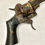 Miniature : Un revolver espagnol en or damasquiné par Zuloaga daté 1863