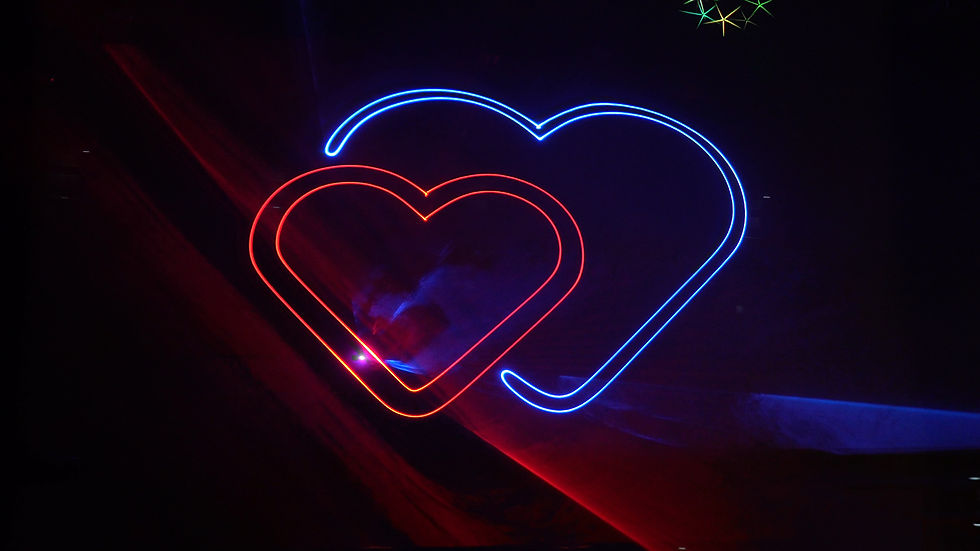 A projected heart inside a heart with a laser