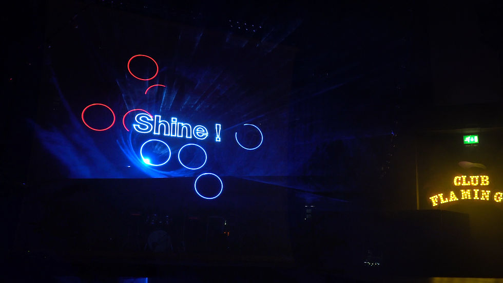The word shine projected in laser
