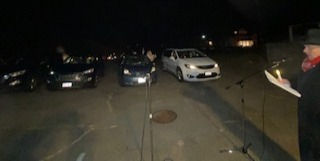Cars parked with Pastor to the side