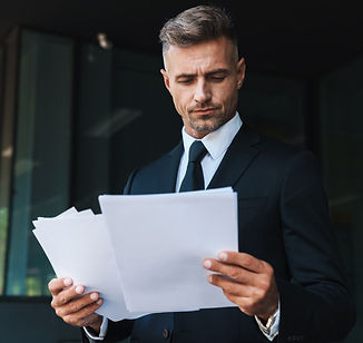 serious-mature-handsome-grey-haired-business-man-outdoors-street-near-business-center-hold