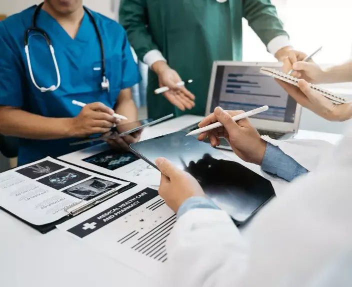 three_doctors_with_tablets.jpeg.webp