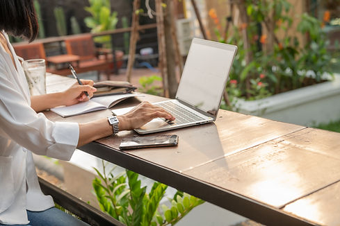 portrait-businesswoman-cafe-using-laptop.jpg