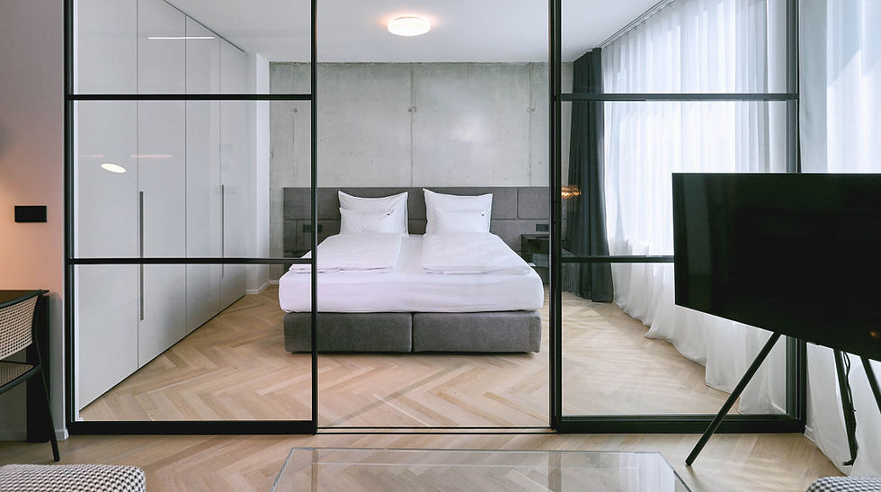 Coliving room with bed and glass partition