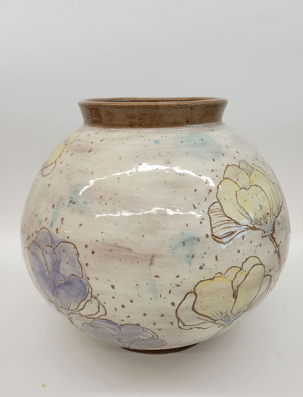 Thumbnail: A moon jar blooming with yellow and purple flowers