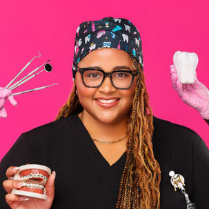 Aspiring orthodontist, Michaela poses with dental equipment.