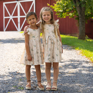 Brynlee with sister hugging outside