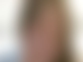 A woman holding her hand up in a "stop" gesture