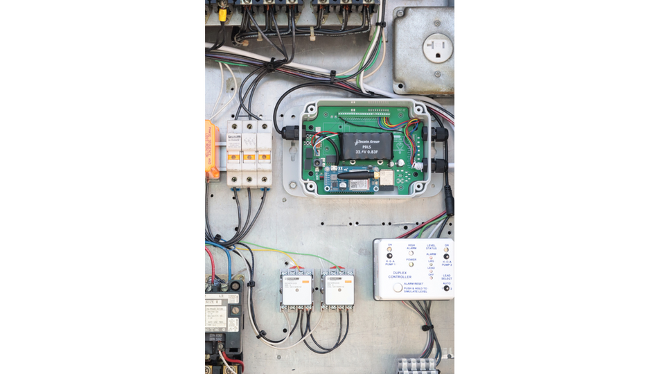 AccuDose RMC-2000 being installed at a lift station. AccuDose manufactured cellular based remote monitoring and control systems.