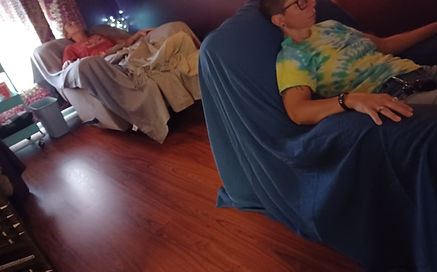 View of community room with two reclining people resting comfortably.