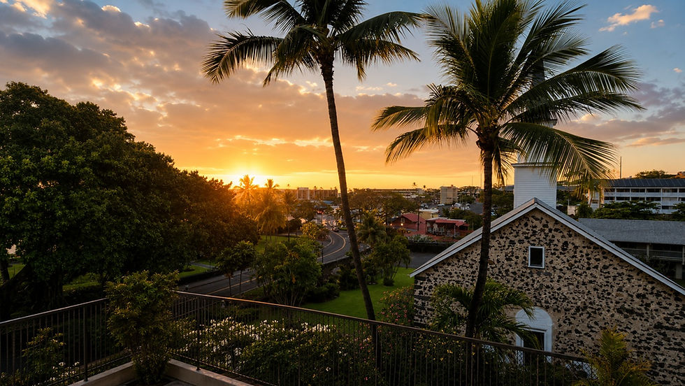 Sunset over Historic Kailua Village from Kona Vista Paradise, with Mokuʻaikaua Church, palm trees, and the Kona coastline