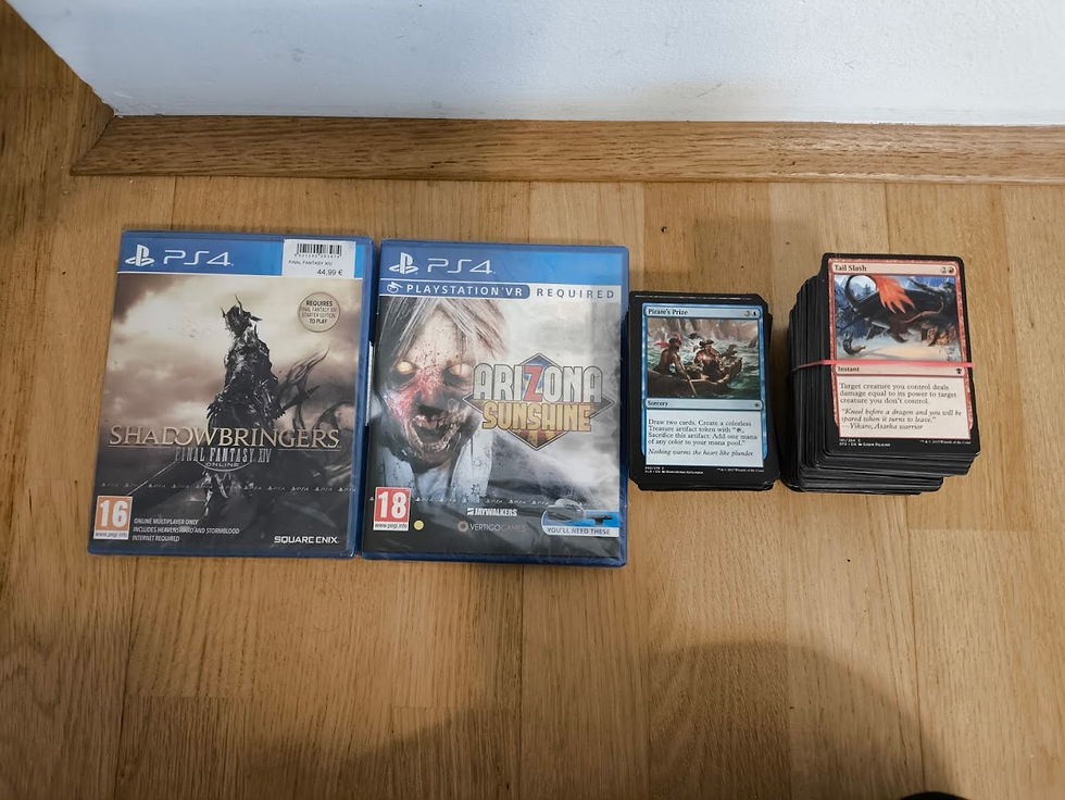 Two PS4 games, "Final Fantasy XIV: Shadowbringers" and "Arizona Sunshine," alongside a stack of Magic the gathering trading cards.