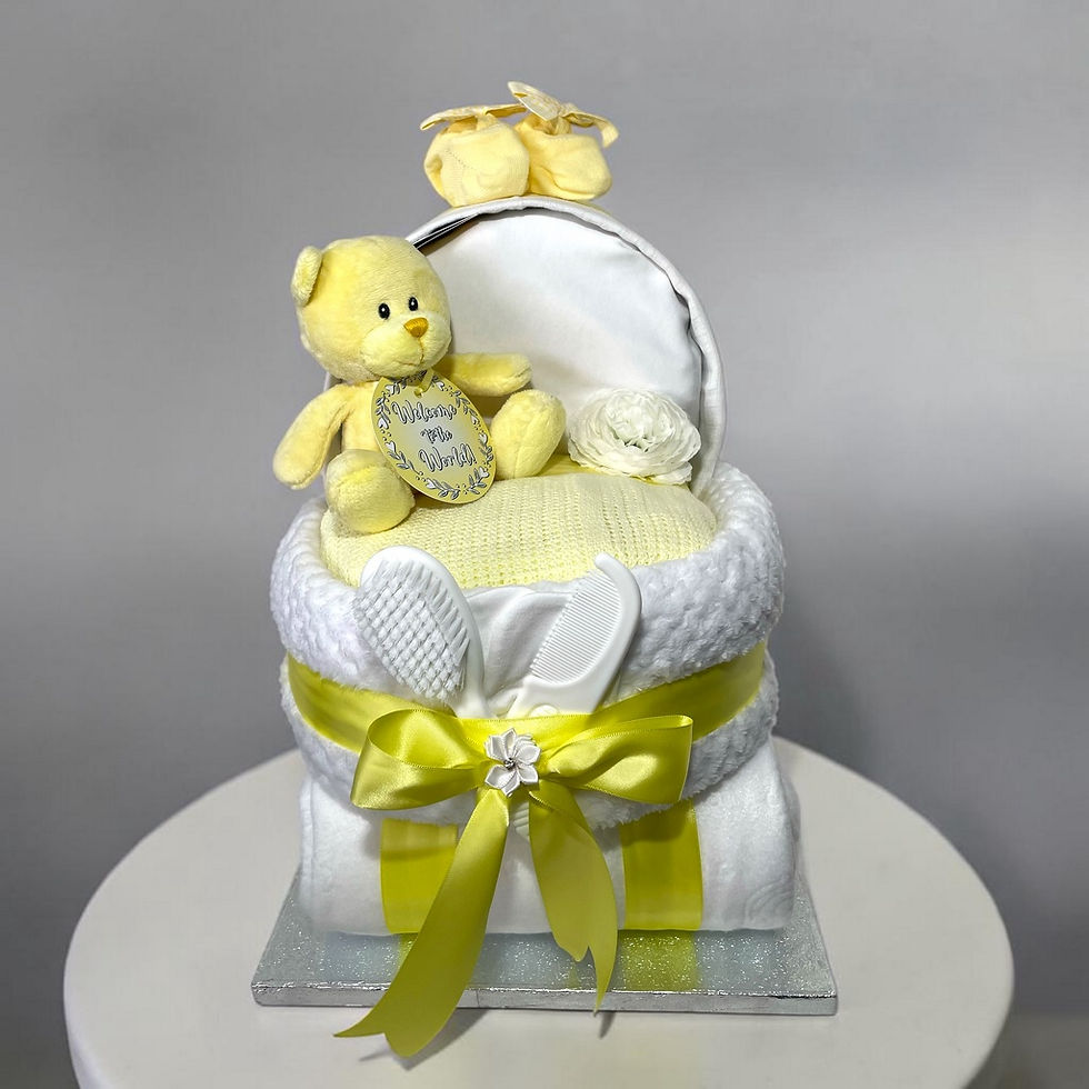 Lemon yellow baby nappy cake pram gift with coordinated essentials