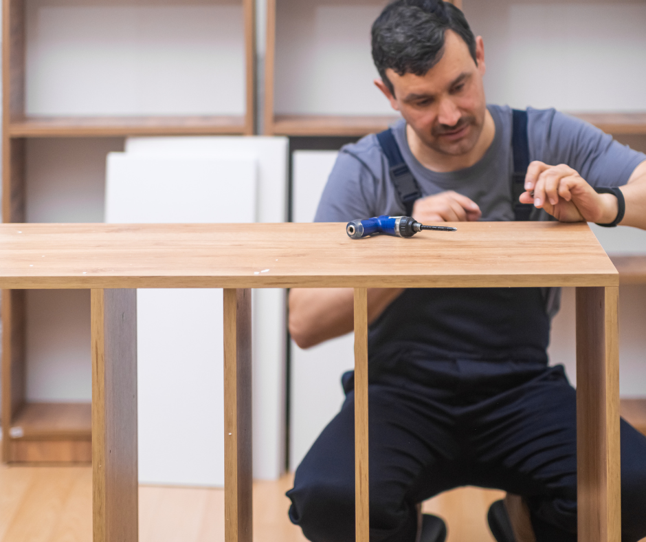 A skilled Co-Tasker putting together a wardrobe in Dortmund. Get your furniture assembled by trusted professionals!