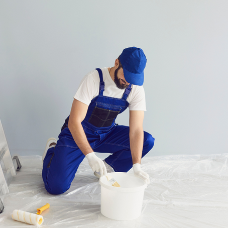 A skilled painter in Essen, booked through Co-Tasker, painting a living room. Find local professionals for home and commercial painting projects today!