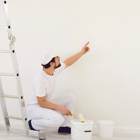 A skilled painter in Dortmund, booked through Co-Tasker, touching up the walls with a fresh coat of paint. Find local professionals for your home painting needs today!