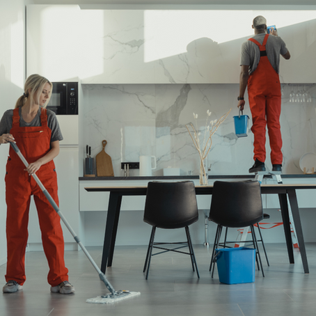 Skilled cleaners in Bonn, booked through Co-Tasker, tidying up a living room. Find local professionals for home and office cleaning today!