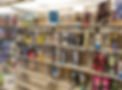 Shelves in the library stocked with various board games in colorful boxes.