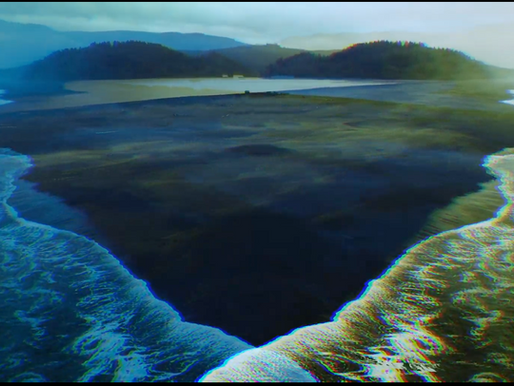mirrored visual effect of ocean waves on a beach