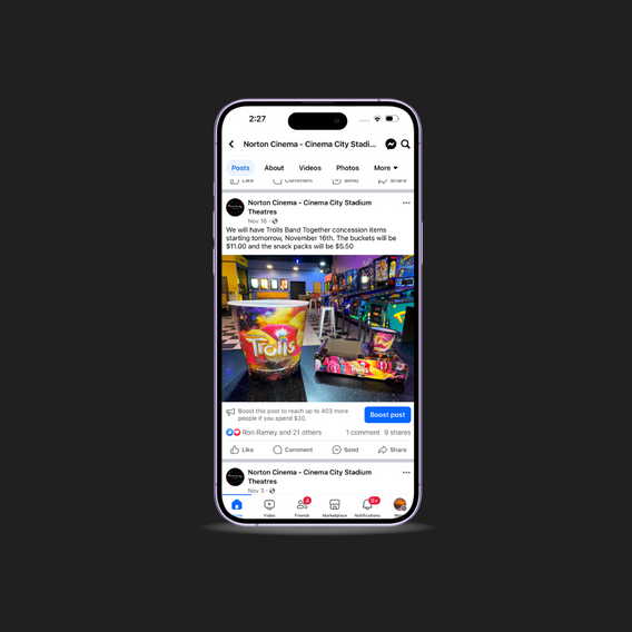 Cell Phone displaying social media post featuring Trolls Band Together concessions