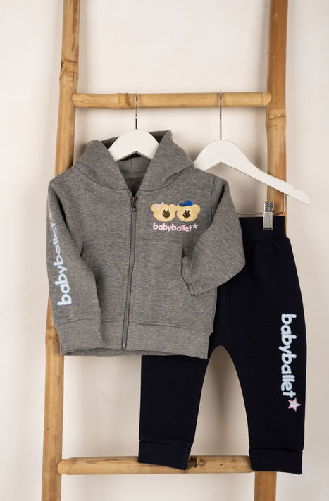 Gray baby tracksuit with "babyballet" logo on rack.